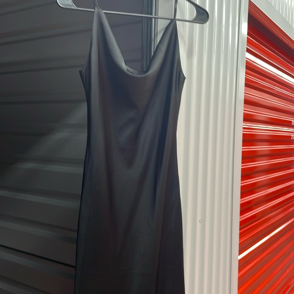 This is a simple, sleek black satin maxi dress.